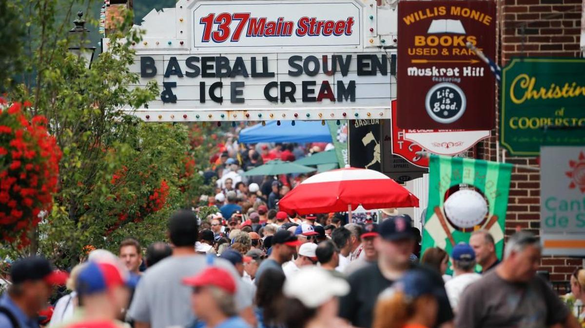 People walk along Main Street on Saturday, July 25, 2015, in Cooperstown, N.Y.