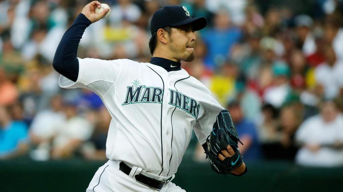 
Seattle Mariners starting pitcher Hisashi Iwakuma throws against the Oakland Athletics in the first inning Monday. Iwakuma and the Mariners allowed seven runs with two outs in the fifth inning and fell, 11-5, to last-place Oakland.
