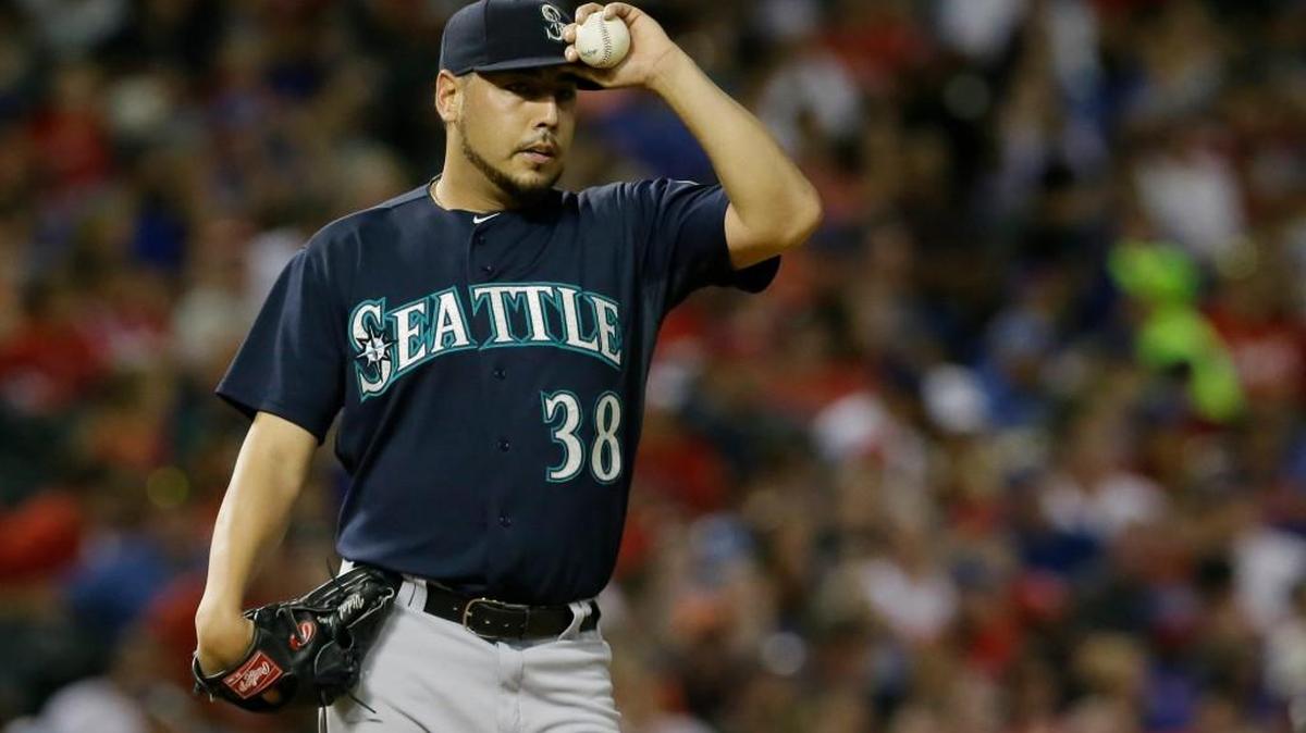 
Seattle Mariners starting pitcher Vidal Nuno composes himself during a baseball game against the Texas Rangers in Arlington, Texas, Saturday, Sept. 19, 2015.
