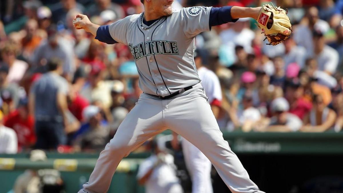
Mariners relief pitcher Danny Farquhar delivers against the Red Sox on Aug. 16. Farquahar was recalled to Seattle from Triple-A Tacoma on Monday.
