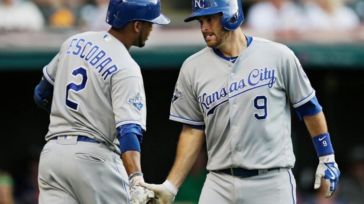 Kansas City’s Drew Butera (9) is congratulated by Alcides Escobar after hitting a solo home run against Cleveland on Friday.