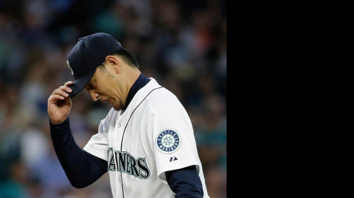 
Seattle Mariners starting pitcher Hisashi Iwakuma adjusts his cap after giving up a run to the Arizona Diamondbacks on Tuesday.
