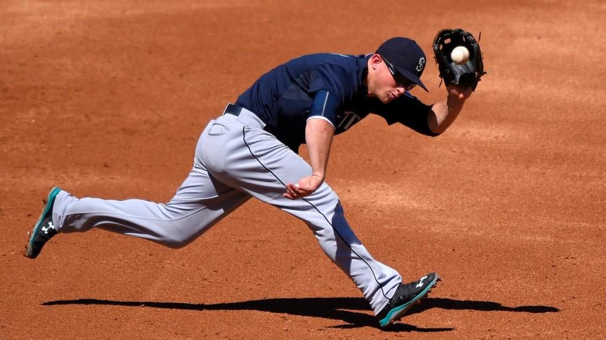 
Seattle Mariners third baseman Kyle Seager fields a ball hit by Johnny Giavotella of the Los Angeles Angels during the third inning Sunday in Anaheim, Calif. Seager threw out Giavotella at first base on the play.
