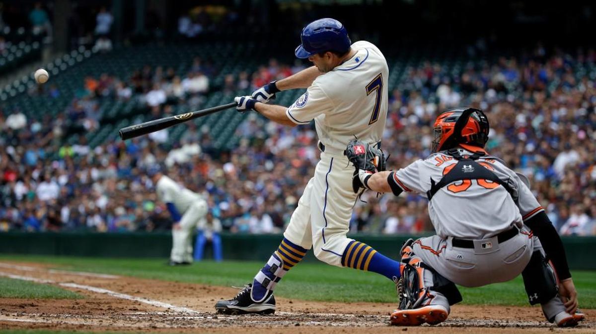 Seattle’s Seth Smith hits a grand slam in the third inning against Baltimore on Sunday in Seattle.