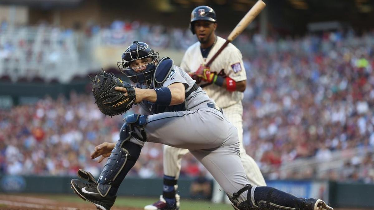 
Seattle Mariners catcher Mike Zunino watches a wild pitch go by that scores the Minnesota Twins' Trevor Plouffe in the third inning in Minneapolis on Saturday. Wild pitches would play a big part in the Mariners’ 3-2 loss to the Twins.
