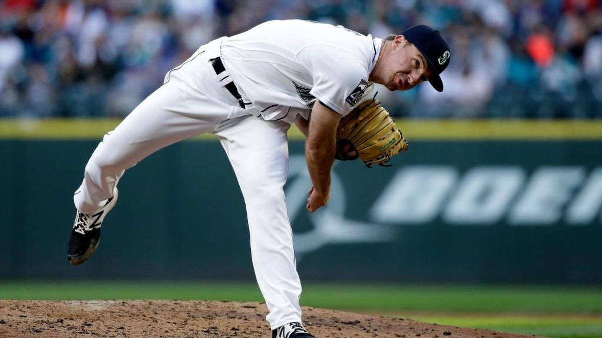Andrew Moore won his big-league debut Thursday when he held Detroit to three runs in seven innings.