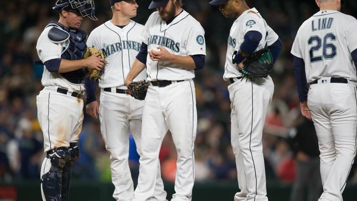 Left-hander Wade Miley (center) had a rough night Saturday. And so did the rest of the Mariners.