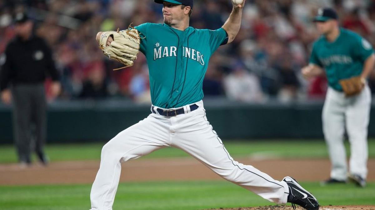 Seattle Mariners starter Wade LeBlanc delivers a pitch during the first inning against St. Louis Friday in Seattle. LeBlanc, making his first start for Seattle, pitched six scoreless innings.