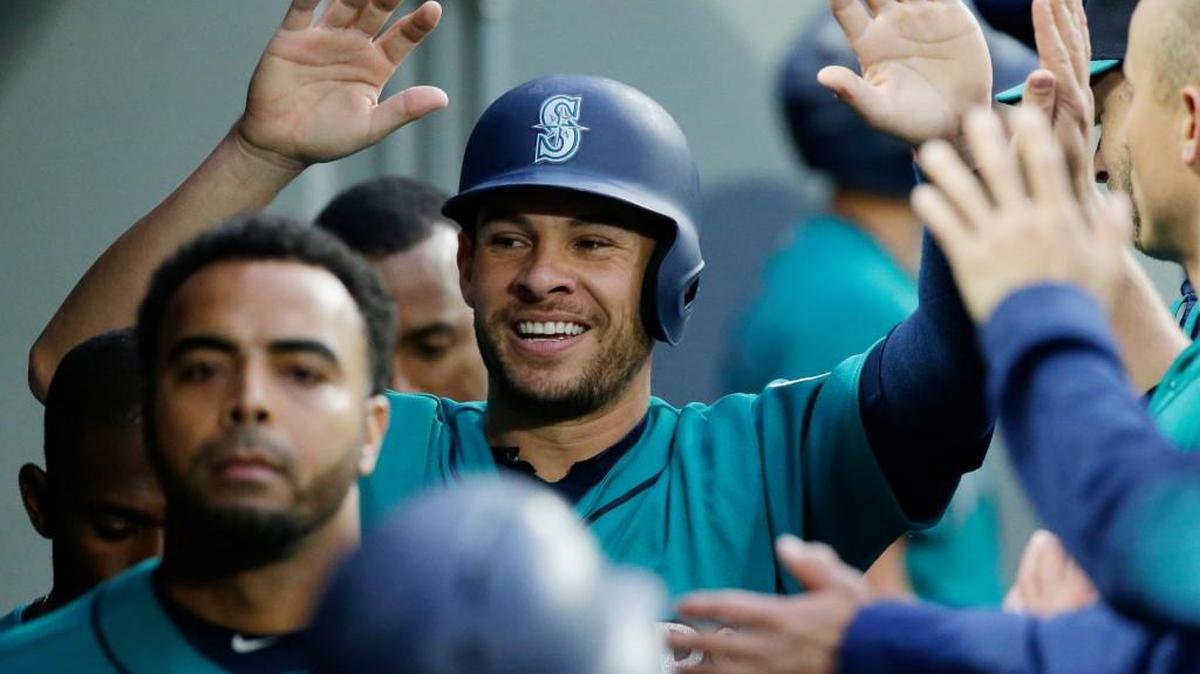Danny Valencia accepted congratulations Friday after scoring on a sacrifice fly, but he injured his hand a few moments earlier while sliding into third base on a triple.