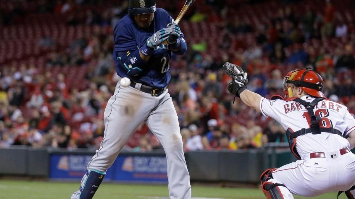 The Mariners scored the tying run in a four-run seventh inning when Robinson Cano was hit by a pitch from Reds reliever Tony Cigrani with the bases loaded.