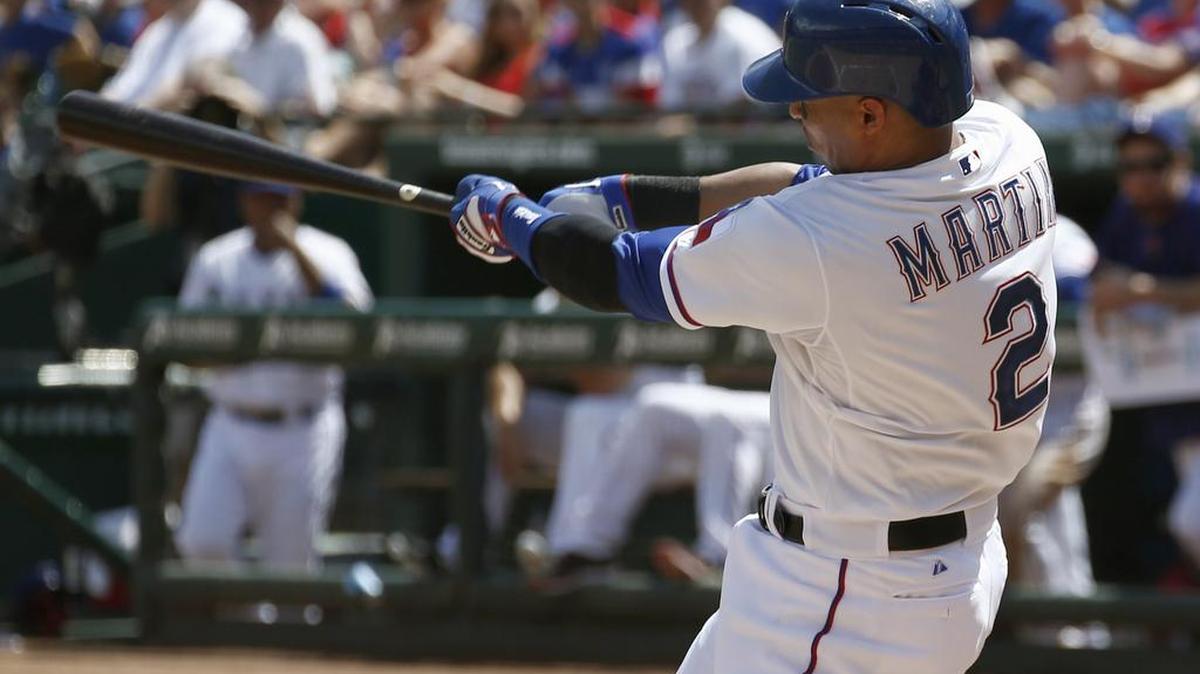Leonys Martin follows through on his RBI single against the Minnesota Twins last season in Arlington, Texas.