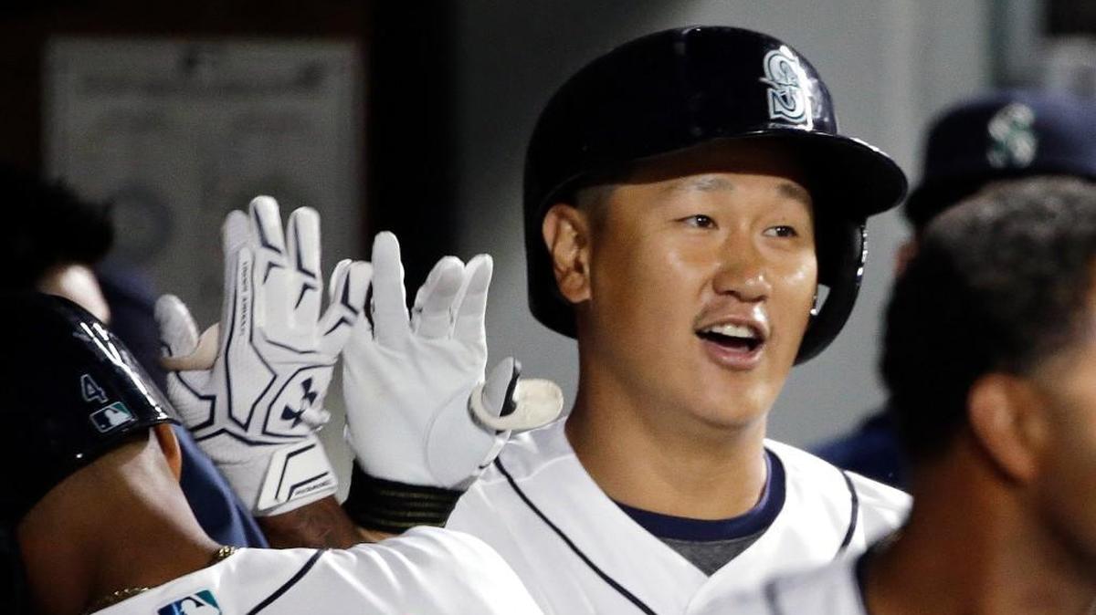 Dae-Ho Lee received congratulations in the dugout after hitting a home run in the fifth inning.