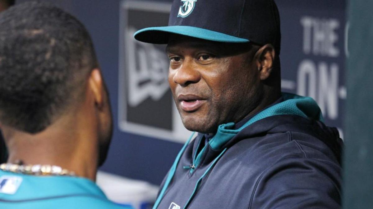 
Seattle Mariners manager Lloyd McClendon talks with players in the dugout during a game on July 10, 2015, in Seattle. Reports indicate that McClendon’s tenure with the Mariners is over.
