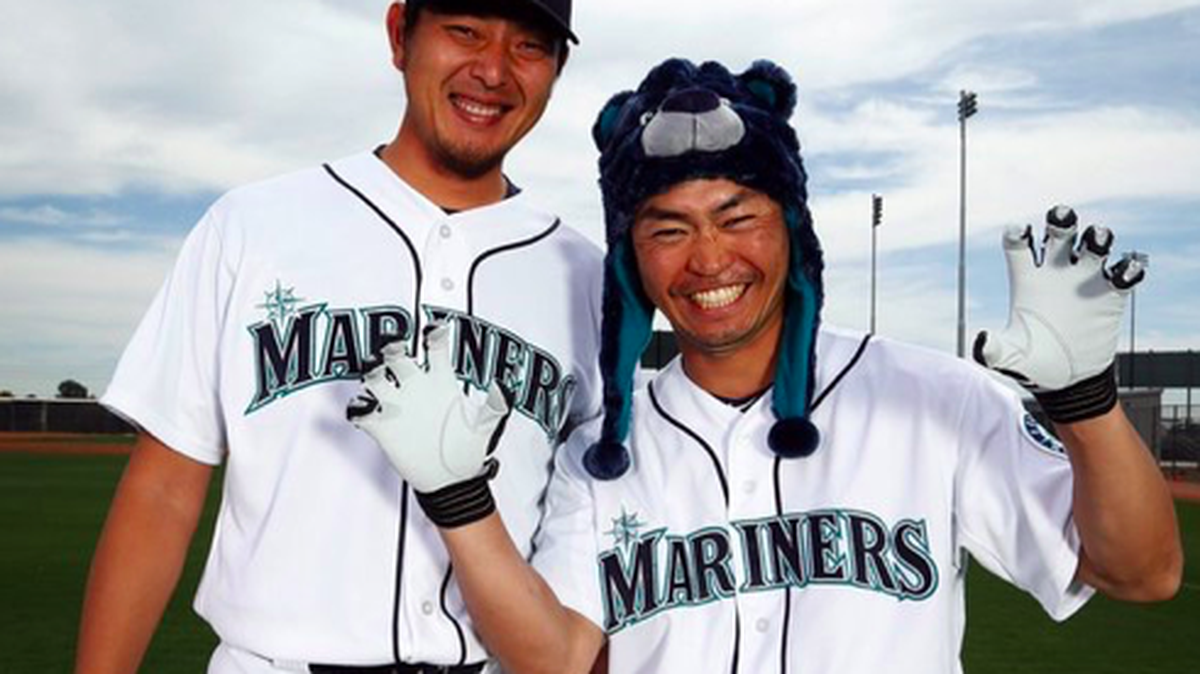 What a week for Nori Aoki (right). He played center field Tuesday for the first time since 2013 and, earlier this week, he donned a Hisashi Iwakuma “bear hat.” Aoki said he’s thinking about wearing the hat in the season opener.
