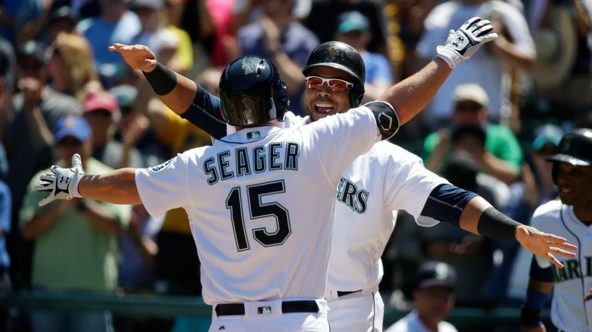 Kyle Seager got a happy embrace from teammate Nelson Cruz after hitting a three-run homer in the second inning. The Mariners enjoyed lots of smiles Tuesday after hitting five home runs in a blowout victory.