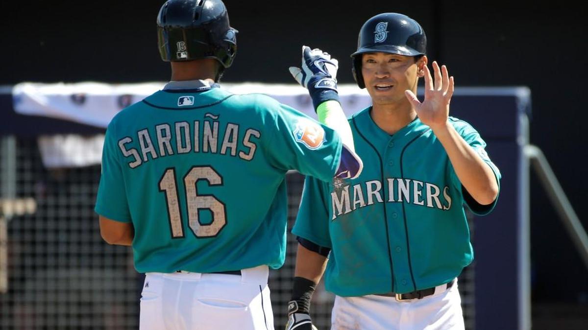 Luis Sardinas receives congratulations from Nori Aoki after tying the game by hitting a two-run homer in the third inning.