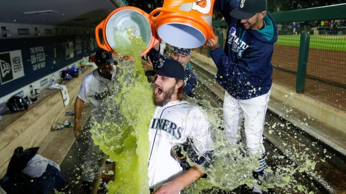 Mariners left-hander Wade Miley was doused by teammates after pitching the first shutout of his career in Saturday’s 6-0 victory over Kansas City.