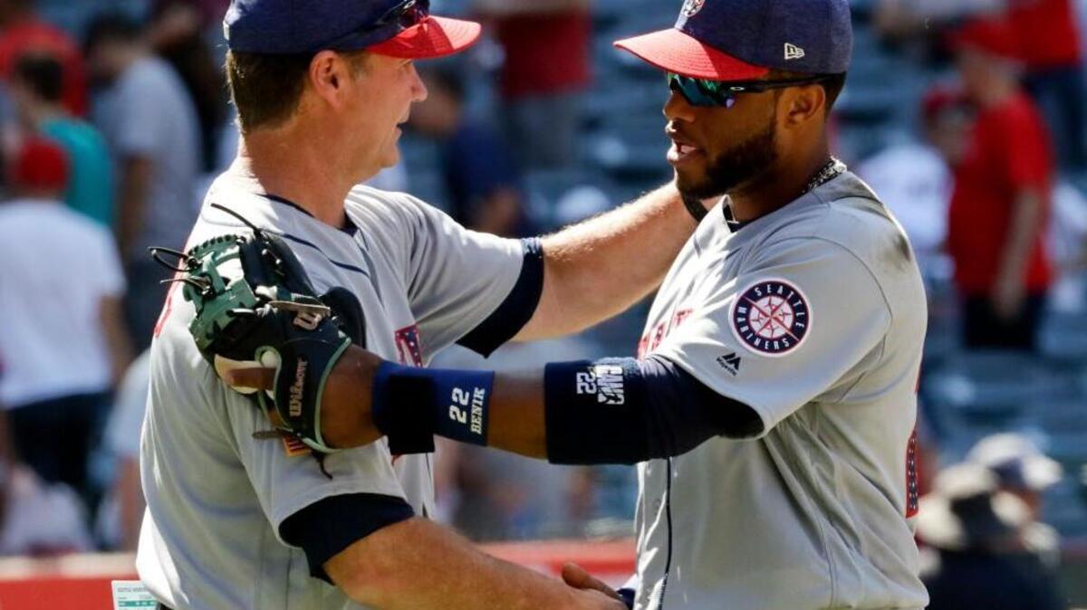 A postgame handshake between manager Scott Servais and second baseman Robinson Cano confirms that the Mariners held on Sunday for a victory over the Angels.