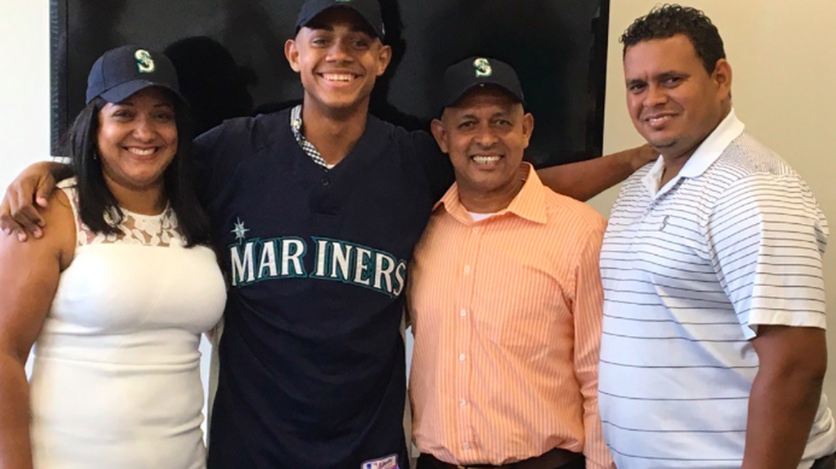 Domincian uutfielder Julio Rodriguez and his family along with scout Kelvin Dominguez.