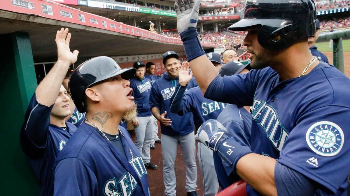 Franklin Gutierrez received an amazed look from Felix Hernandez after returning to the dugout following his 473-foot homer in the fourth inning.
