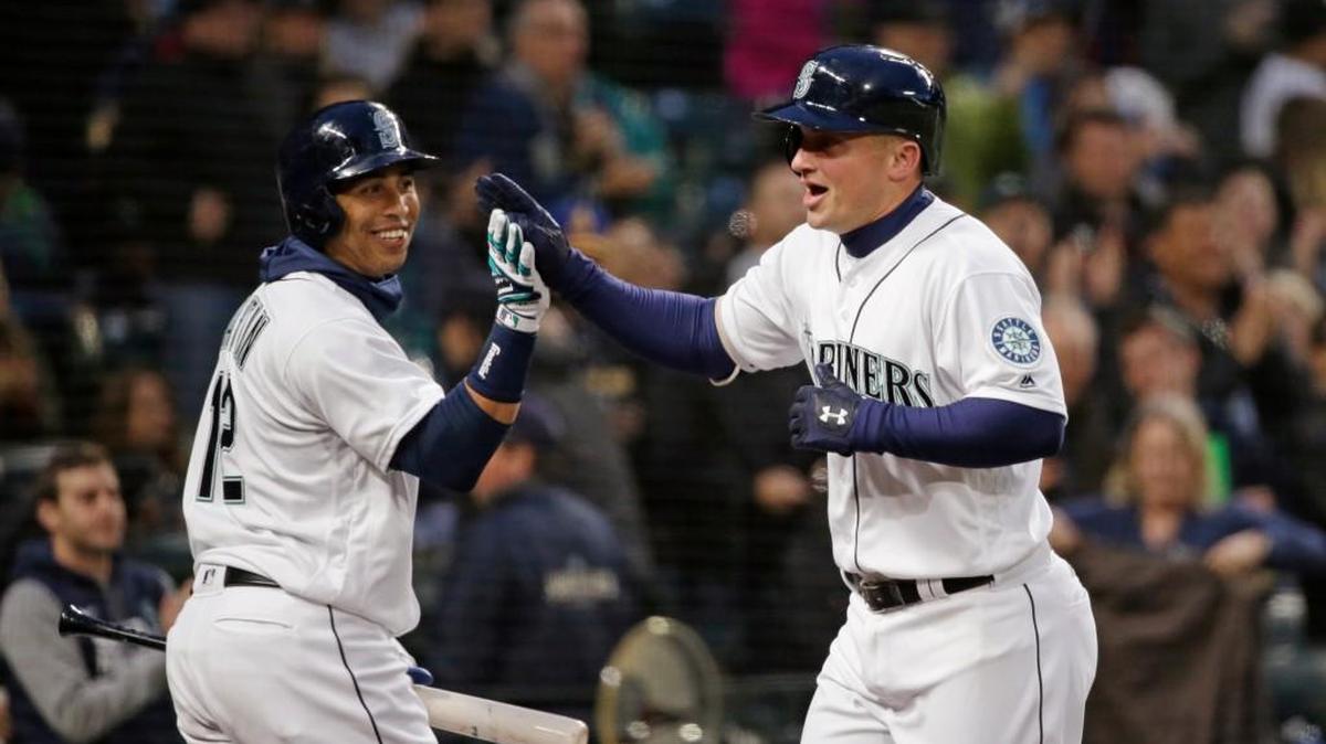 Kyle Seager (right) received congratulations from Leonys Martin after hitting his 100th career homer, which gave the Mariners a 2-1 lead in the fourth inning. Martin hit a homer earlier in the game.