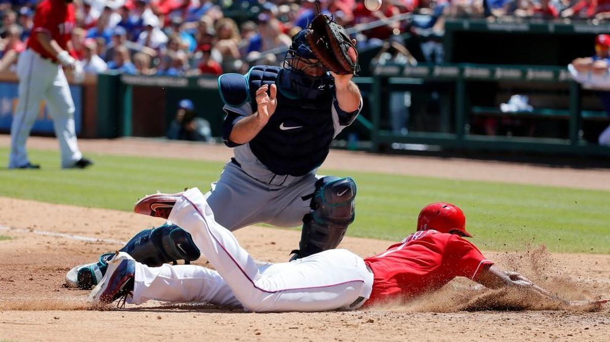 Elvis Andrus raced home to score the tying run in Texas’ three-run fifth inning by taking advantage of a soft, looping throw by Mariners left fielder Stefen Romero.
