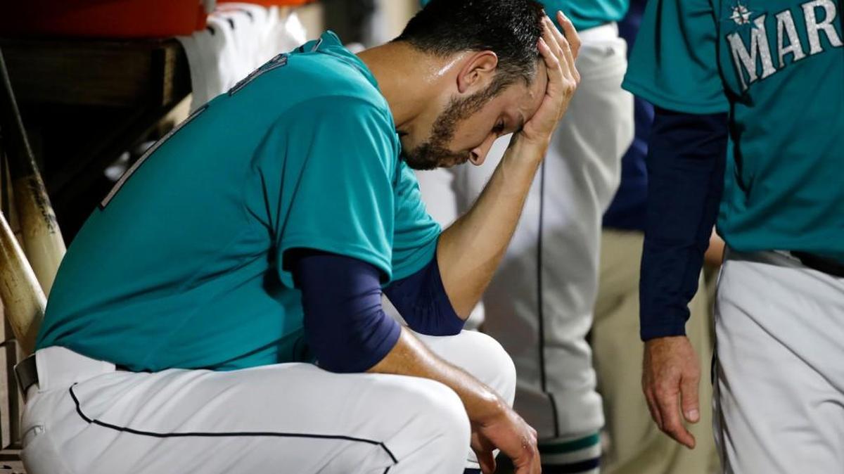 A disconsolate Steve Cishek sat in the dugout after giving up the tying and winning runs in the ninth inning.