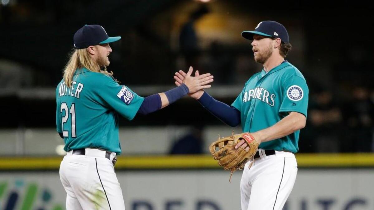 Taylor Motter (left) and Tyler Smith each had memorable games Friday when the Mariners beat Tampa Bay 12-4 at Safeco Field.