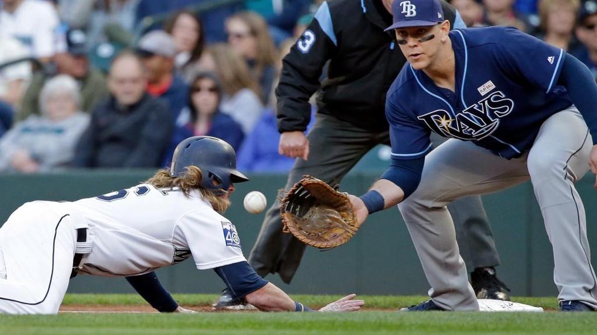 Ben Gamel dives back safely to first base earlier this season against Tampa Bay but, too often this season, the Mariners have run into outs on the bases.