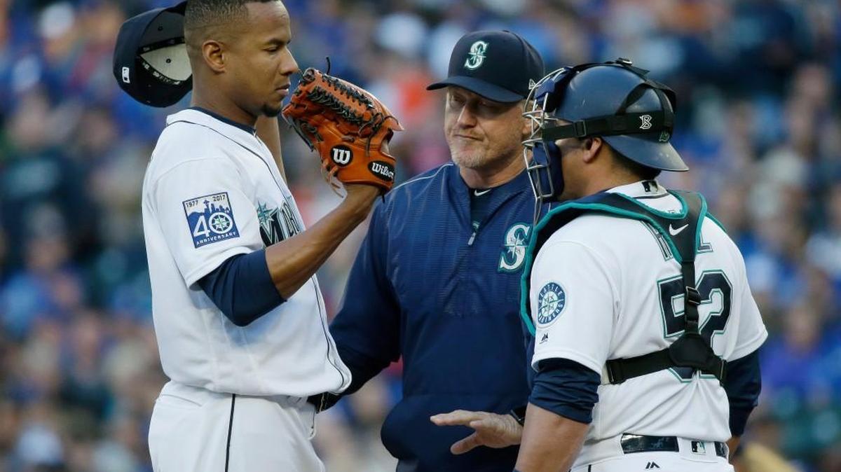 Ariel Miranda gets a visit from pitching coach Mel Stottlemyre and catcher Chooch Ruiz.