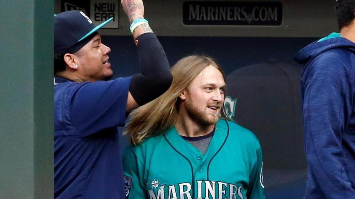 Taylor Motter was all smiles after getting congratulations from Felix Hernandez and others following his grand slam in the first inning.