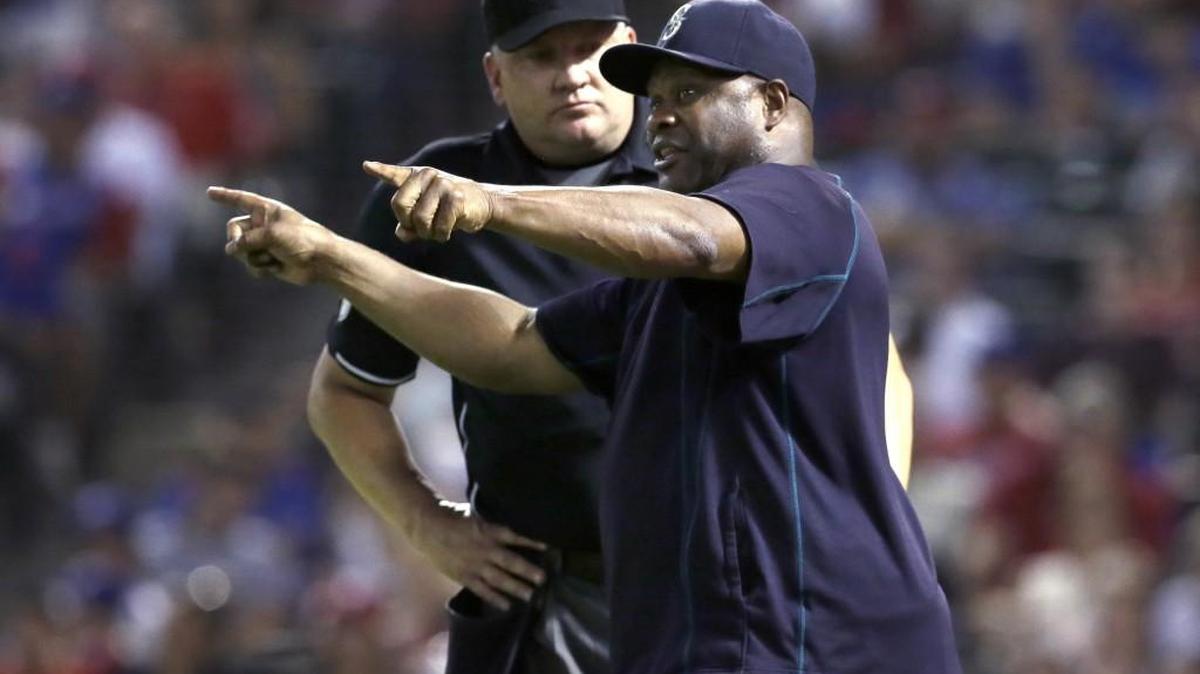 
Seattle Mariners manager Lloyd McClendon, right, argues a call with umpire Jeff Nelson in the fourth inning Sept. 18 against the Texas Rangers in Arlington. McClendon spoke with new GM Jerry Dipoto for a couple of hours Monday and said of the meeting, “It was great.”
