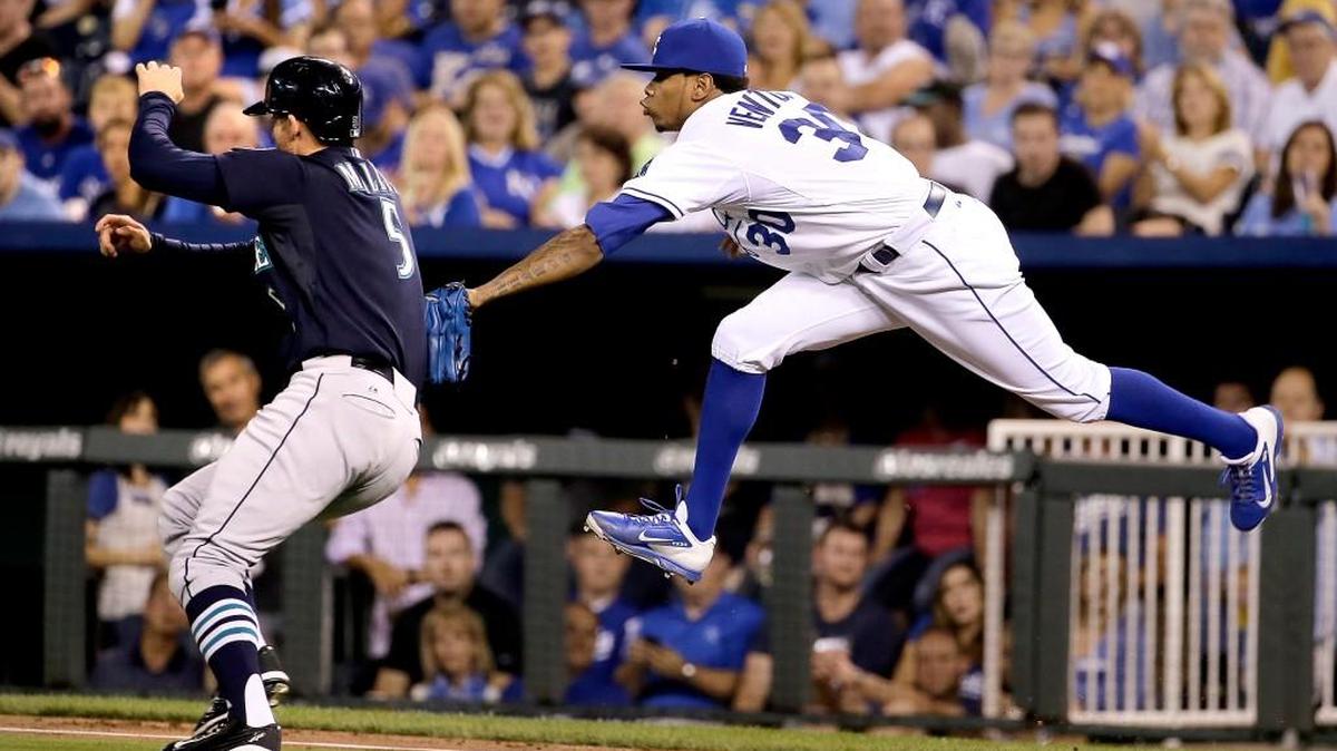 
Royals starting pitcher Yordano Ventura tags out the Mariners’ Brad Miller (5) along the first base line after Miller grounded to Ventura during the third inning Wednesday night in Kansas City, Mo.
