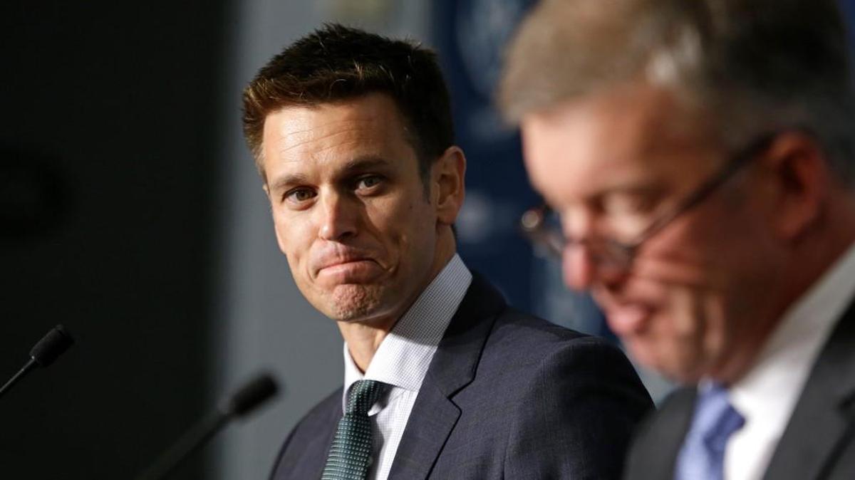 
New Seattle Mariners general manager Jerry Dipoto, left, looks on as team president Kevin Mather speaks at a news conference Tuesday, Sept. 29, 2015, in Seattle. For Dipoto, being hired by the Mariners as their new general manager comes with one task above all others: Ending the longest postseason drought in baseball.
