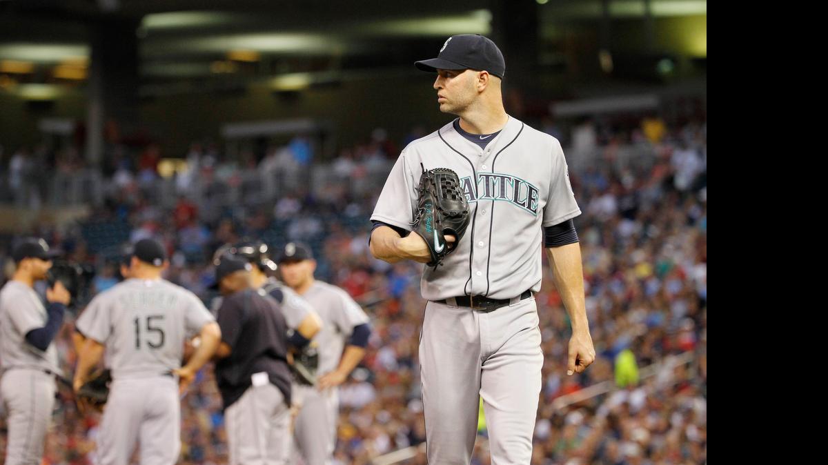 
Mariners pitcher J.A. Happ leaves the mound after getting pulled in the fourth inning Thursday. Happ gave up seven runs on nine hits in 3
1/3 innings. The Twins won the game, 9-5.
