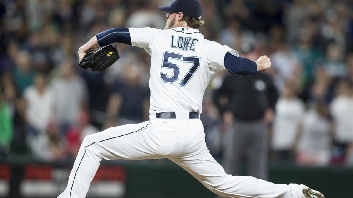 
Seattle Mariners reliever Mark Lowe delivers a pitch in the ninth inning of a game against the Los Angeles Angels on July 11. The Mariners traded Lowe to the Toronto Blue Jays on Friday.
