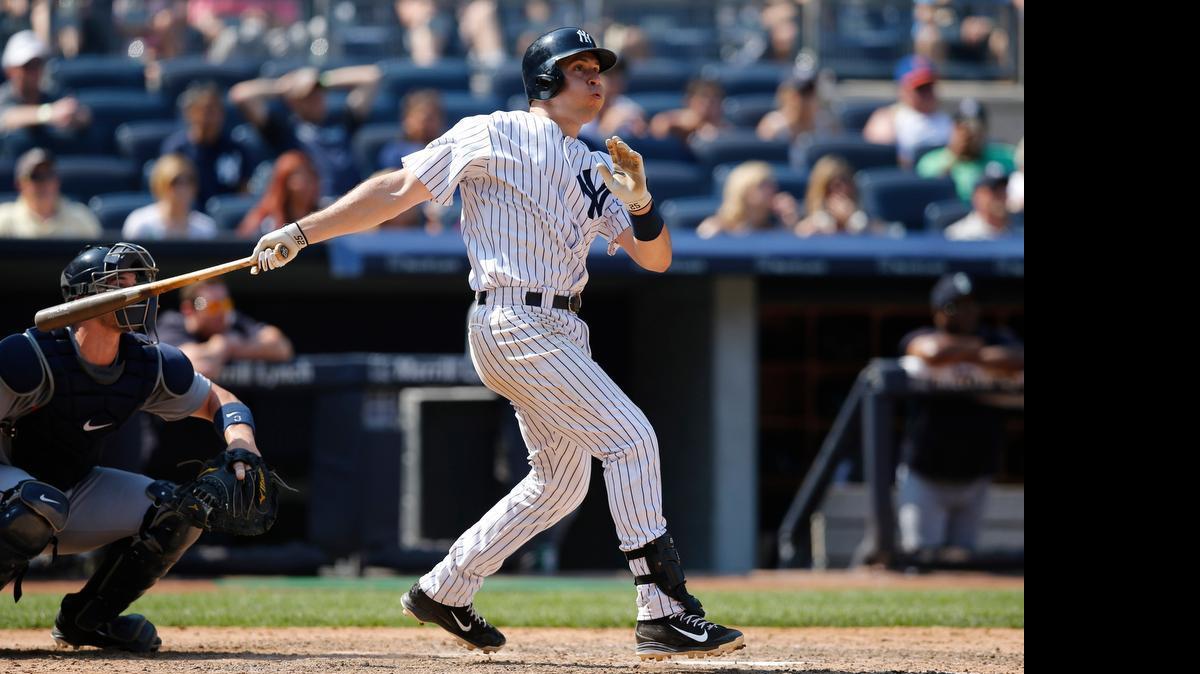 
New York Yankees batter Mark Teixeira watches his eighth-inning solo home run off Fernando Rodney.
