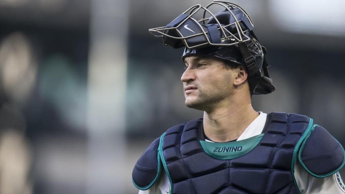 Seattle Mariners catcher Mike Zunino walks to the dugout before a baseball game against the Oakland Athletics, Tuesday, Aug. 25, 2015, in Seattle.
