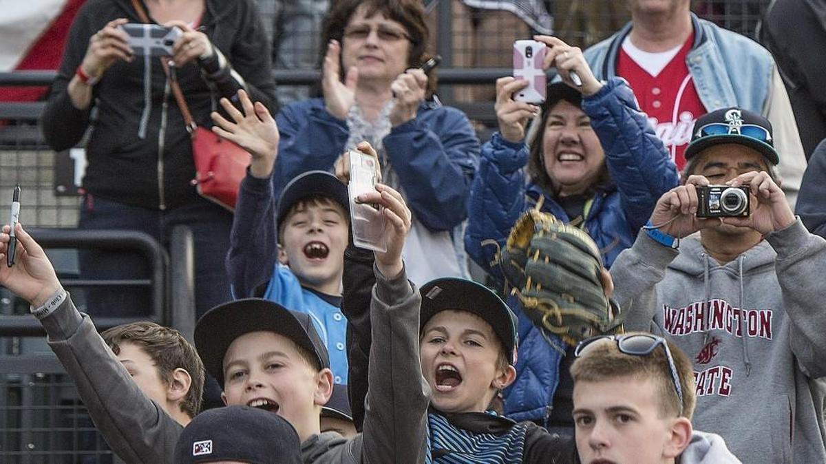 Fans cheer during the Tacoma Rainiers’ 2015 home opener at Cheney Stadium. Tacoma will host the 2017 Triple-A All Star Game.