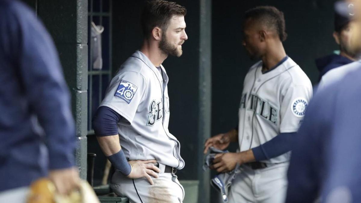 Mitch Haniger sits on the bench after being pulled for a pinch runner in Detroit on April 25. He hasn’t played in the majors since then, but did get into his second rehab game with the Rainiers on Wednesday.