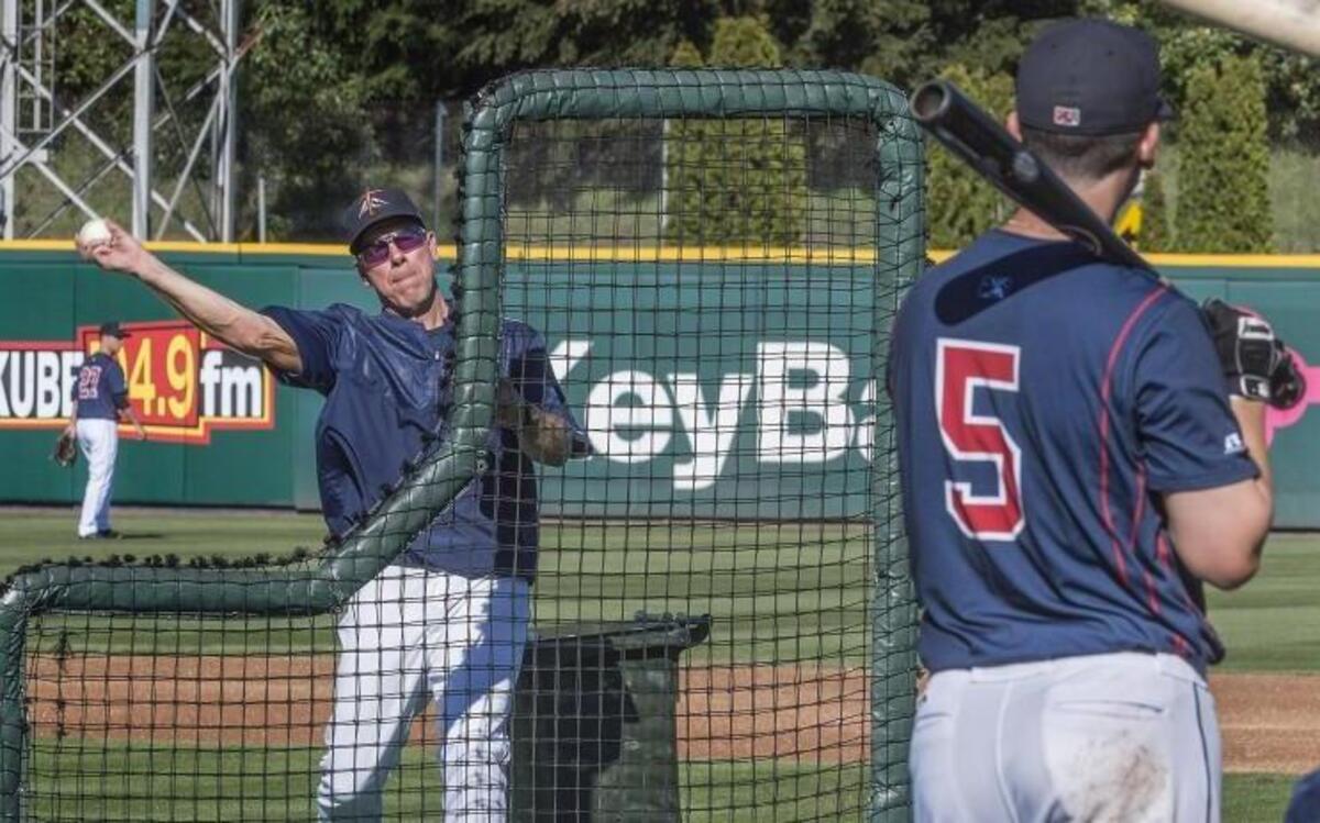 Hitting coach Scott Brosius throws batting practice in April before the Tacoma Rainiers’ season opener against the Albuquerque Isotopes at Cheney Stadium.