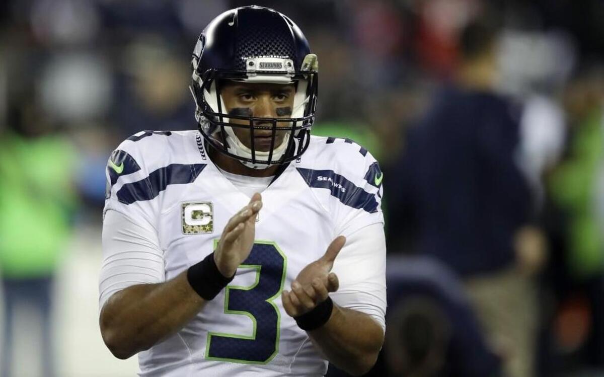 Seattle Seahawks quarterback Russell Wilson warms up before Sunday’s game against the New England Patriots.