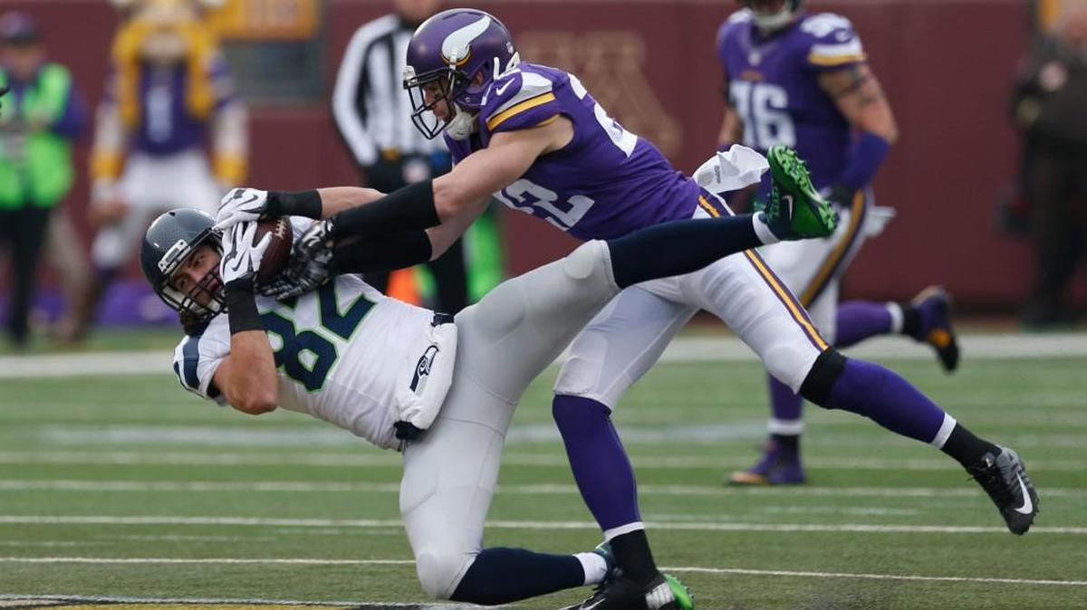 Seattle tight end Luke Willson (82) catches a pass as Minnesota safety Harrison Smith (22) defends on Dec. 6 during the Seahawks’ 38-7 victory in Minnesota.