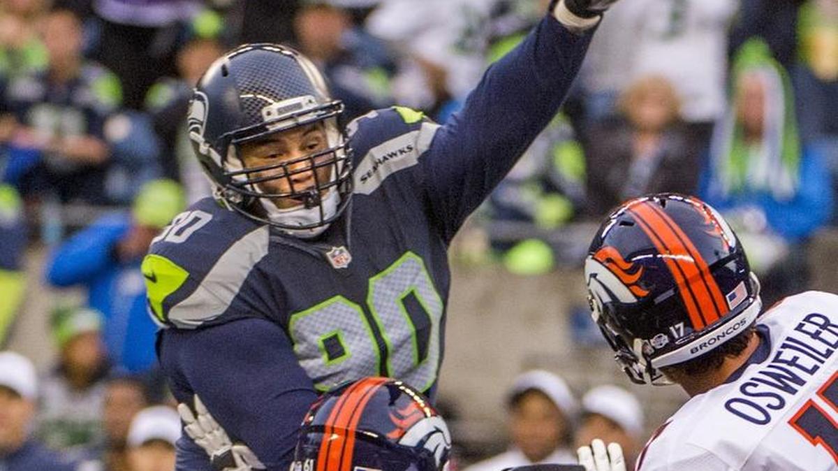 
Seahawks defensive lineman Jesse Williams attempts to block a pass in the second quarter of an NFL preseason football game between Seattle and Denver at Century Link Field in Seattle, August 14, 2015.
