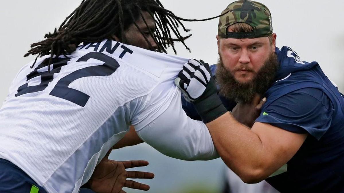 Seattle Seahawks defensive tackle Brandin Bryant, left, blocks Mark Glowinski during Seahawks training camp Aug. 6.