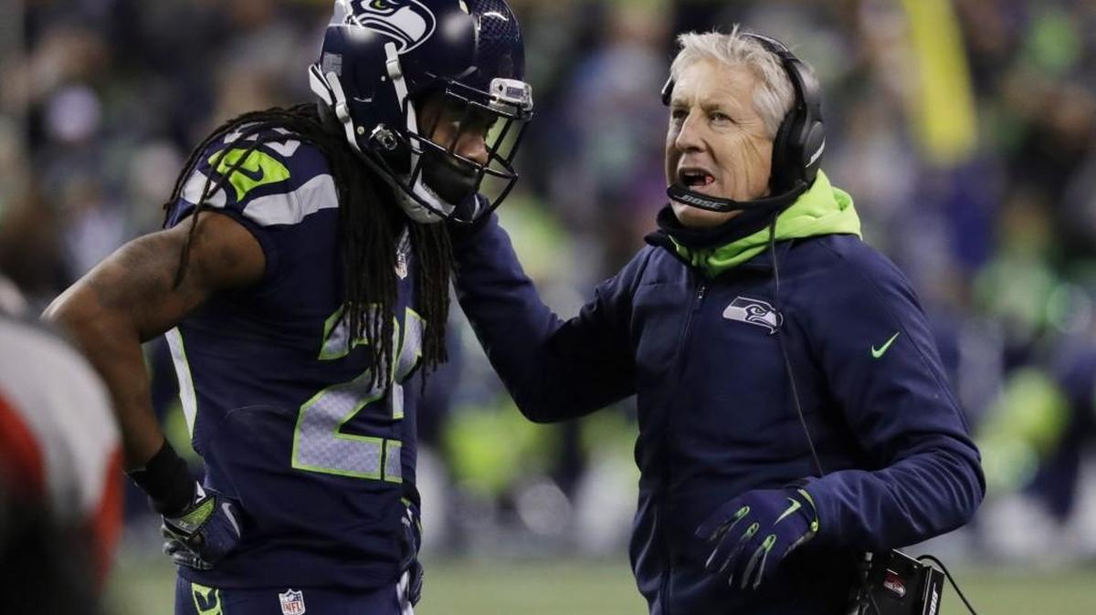 Seattle Seahawks coach Pete Carroll talks with cornerback Richard Sherman during the NFC wild card playoff game against the Detroit Lions on Jan. 7 in Seattle.