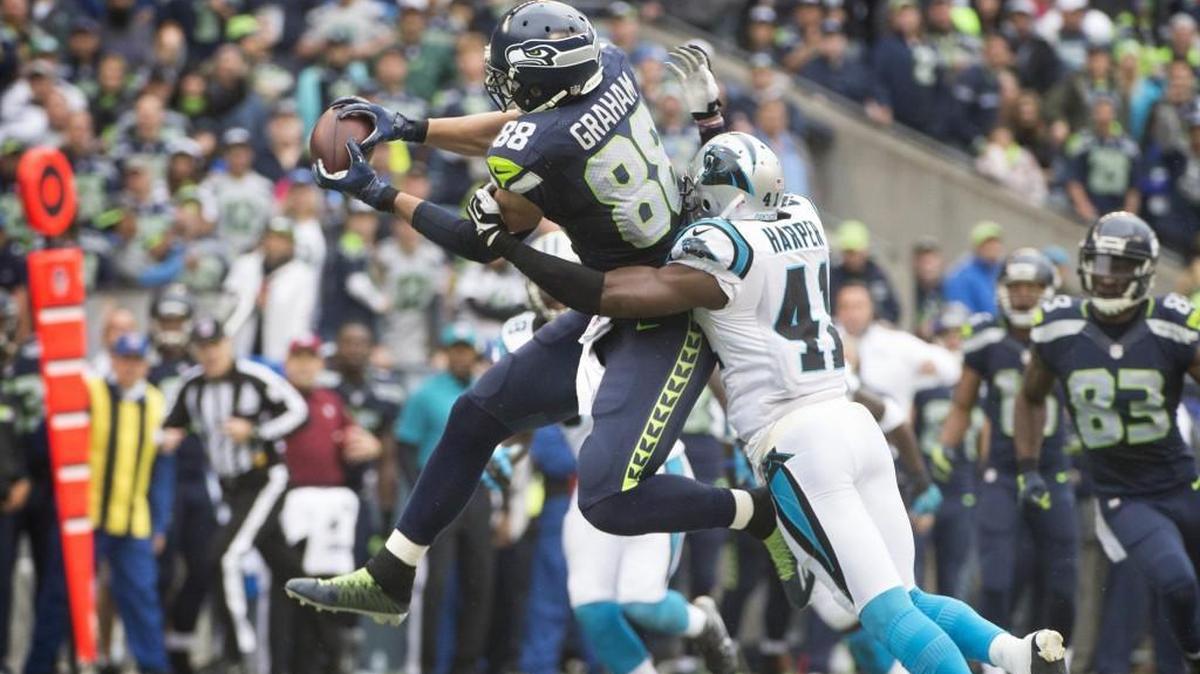 
Seahawks tight end Jimmy Graham pulls down a pass reception over Panthers safety Roman Harper during Sunday’s game at CenturyLink Field.
