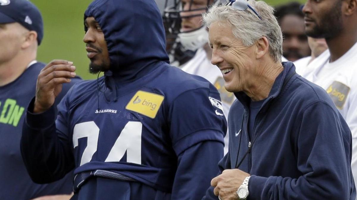 Seahawks head coach Pete Carroll, right, should let Marshawn Lynch start Sunday if he is healthy. The team can worry about Lynch’s future after it is eliminated — or wins the Super Bowl.
