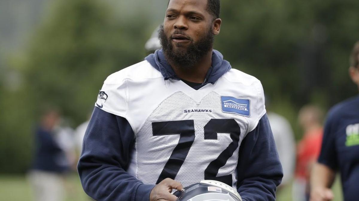 The Seahawks’ Michael Bennett walks on the field during training camp. Bennett says teammates should have respect for one another and not be out to hurt each other.