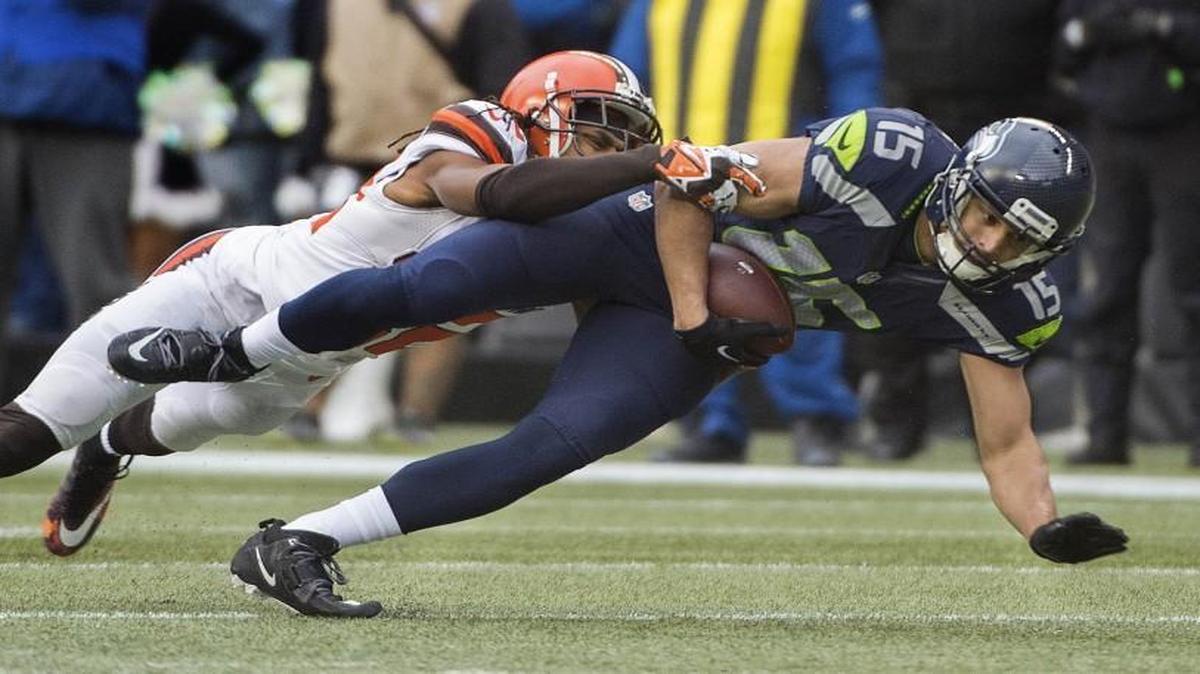Seahawks receiver Jermaine Kearse is brought down after making a catch against Cleveland. Photo taken in Seattle on Sunday, Dec. 20, 2015.